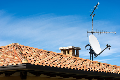 Television Aerial and Satellite Dish on the House Roof