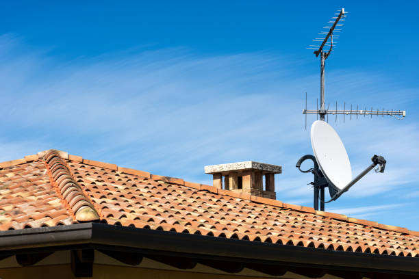 television aerial and satellite dish on the house roof - television aerial antenna television broadcasting imagens e fotografias de stock