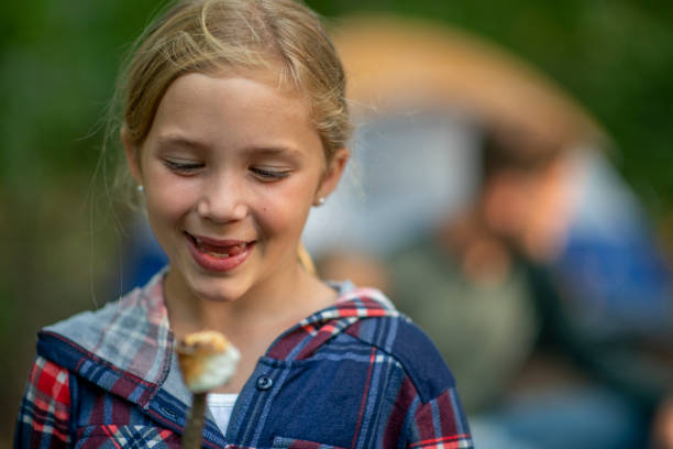 istock Family enjoying a summer camping trip 1253410179