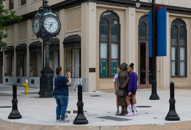 Montgomery, Alabama/USA-June 27, 2020: Tourists taking their photo with the bronze statue of Rosa Parks  in downtown Montgomery.
