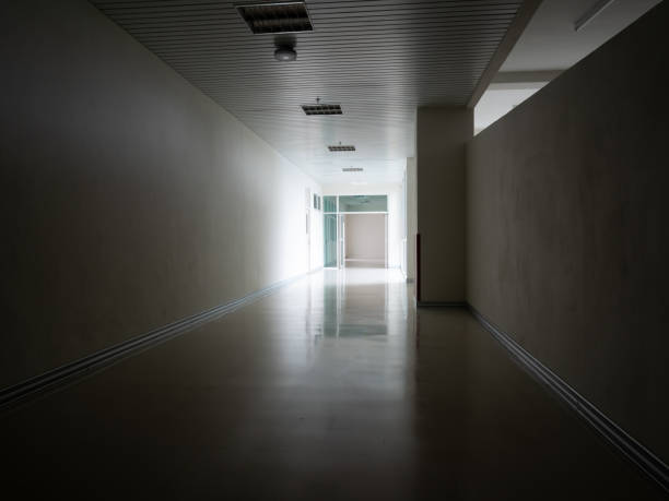 istock Light at the exit of the corridor in the building 1253411693