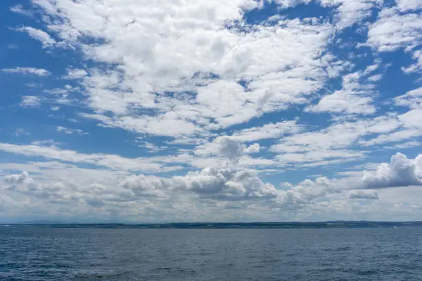 An expressive cloudscape over the shores and waters of Lake Constance in southern Germany