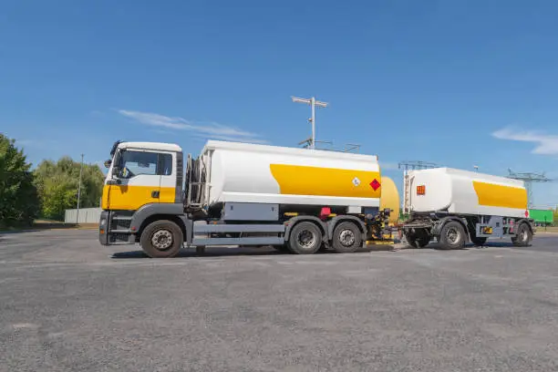 Dangerous goods Trucks with dangerous goods signs for flammable liquid substances 3 and environmentally hazardous substances according to ADR 2009