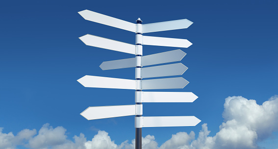 Blank signpost over clear blue sky
