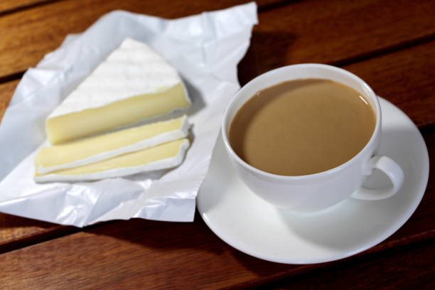 istock Coffee with milk and brie cheese for breakfast. 1253415202