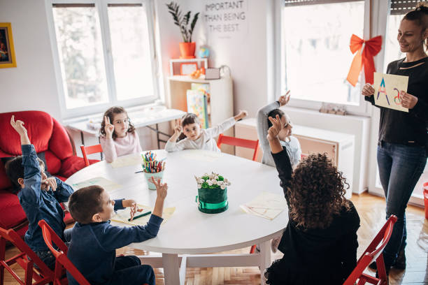 istock Preschool kids learning letters 1253415442