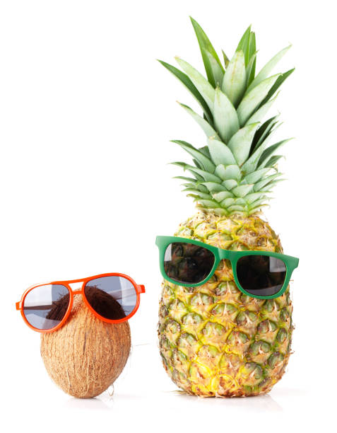 istock Ripe pineapple and coconut with sunglasses 1253416782
