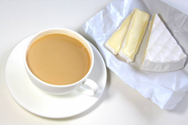 istock Coffee with milk and brie cheese for breakfast. 1253417180