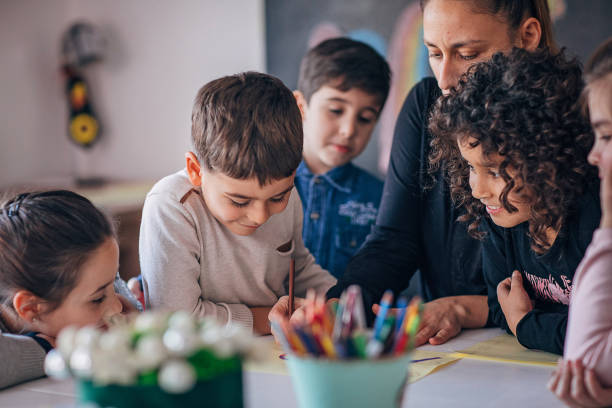 istock Group of children learning writing in preschool 1253417313