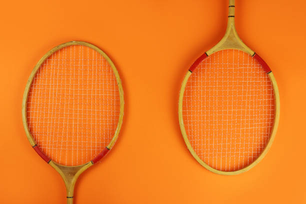 istock badminton rackets on a bright orange background 1253417531