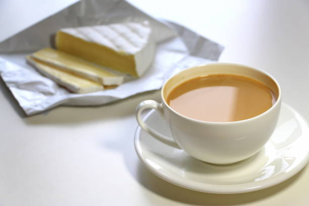 istock Coffee with milk and brie cheese for breakfast. 1253419839