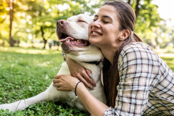 istock Young woman with dog 1253420667