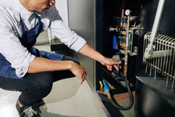 istock Man turning on gas supply 1253421548