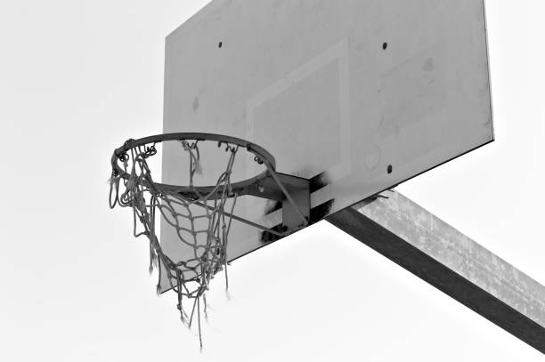 Basketball hoop with the net hooked to the basketball ring (Pesaro, Italy, Europe) Basketball hoop with the net hooked to the basketball ring (Pesaro, Italy, Europe) back board basketball stock pictures, royalty-free photos & images