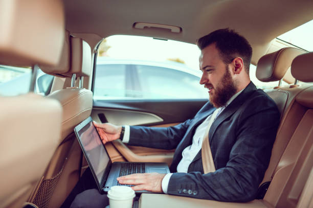 istock Young Businessman Working On Laptop And Enjoying Coffee While Traveling 1253424190