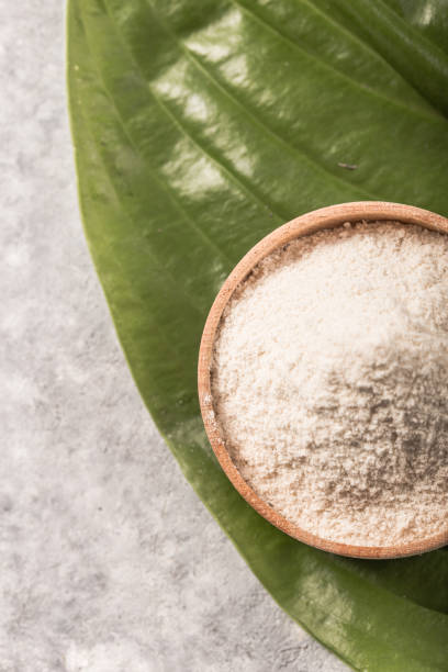 istock Collagen powder over green textured leaf background with copy space. Dietary nutritional supplement 1253424471