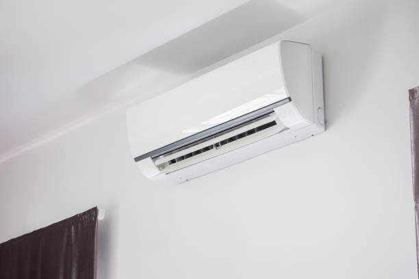 istock Air conditioner on white wall room interior background 1253426315