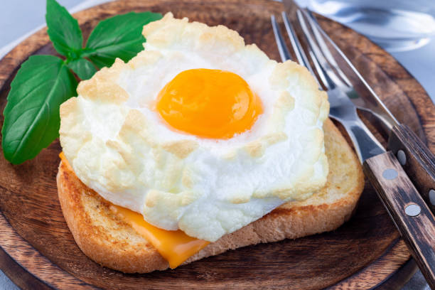 istock Trendy cloud or fluffy egg dish on a wooden plate, horizontal 1253426878
