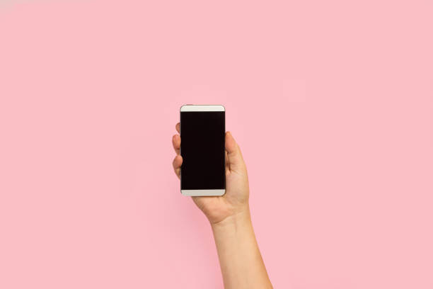 istock Woman hand holding a smartphone 1253426916