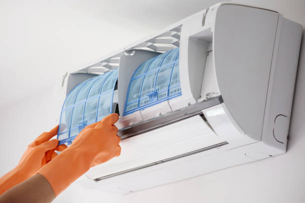 istock Asian man hand hold air conditioner filter cleaning concept 1253427233