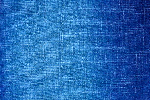 istock Denim blue jeans texture close up background top view 1253427999