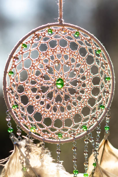 istock Handmade dream catcher with feathers threads and beads rope hanging 1253429494