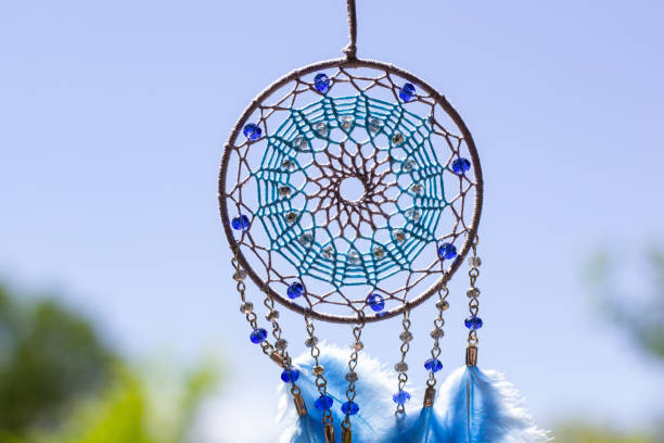 istock Handmade dream catcher with feathers threads and beads rope hanging 1253429562
