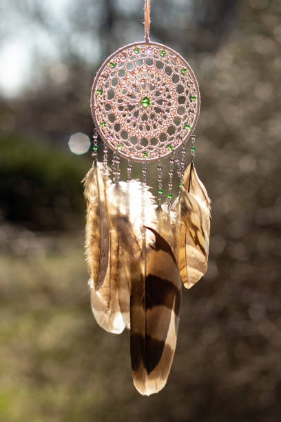 istock Handmade dream catcher with feathers threads and beads rope hanging 1253429574