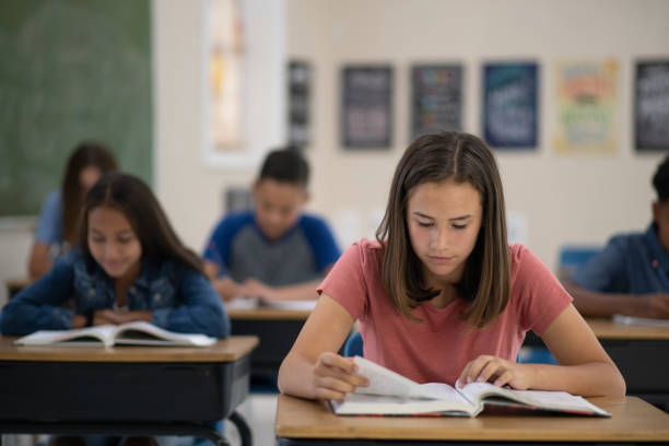 istock Studious girl in middle school keeping social distance 1253429683