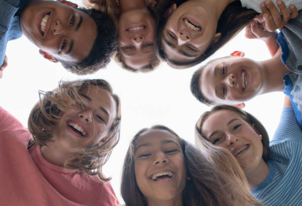 istock Young smiling faces in the summer time 1253429704
