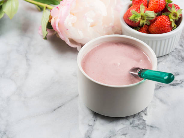 istock Strawberry yogurt in small ramekin on marble 1253430001
