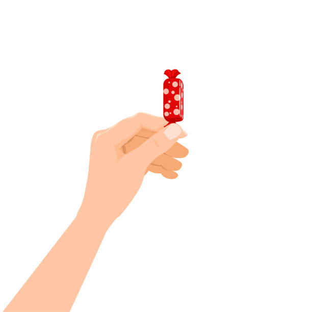 istock Hand hold candy wrapper dessert sweetness. Vector illustration isolated cartoon style 1253430624