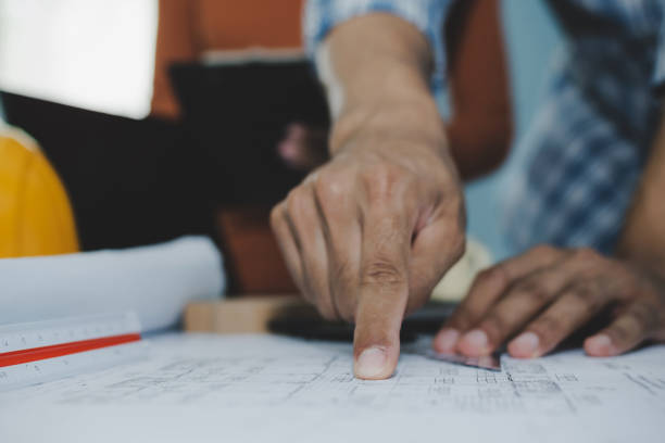 istock group of colleagues architect or interior designer planning and working on blueprint on desk in meeting room office at construction site, contractor, construction industrial, engineering concept 1253430709