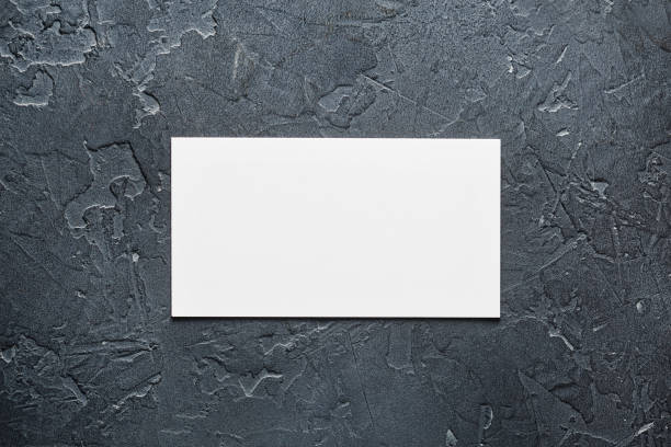 istock White Blank business card on concrete background. Place for ID 1253430803