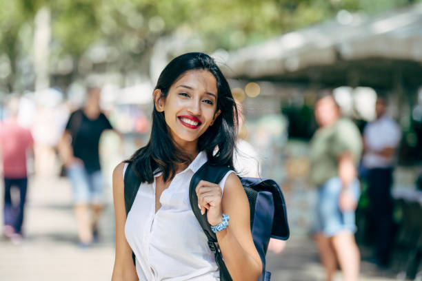 istock Independent female backpacker enjoying sunny Barcelona 1253430997