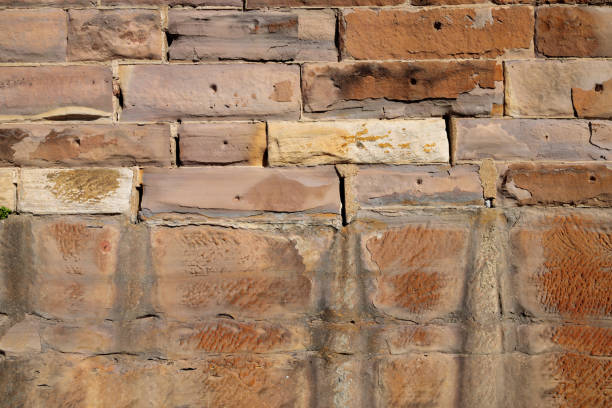 Repeating pattern of bricks in a rock wall