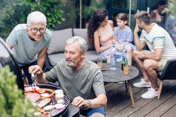 istock Seniors making barbecue for their family 1253434075