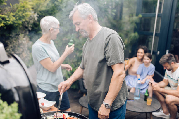 istock Seniors making family  barbecue for the weekend 1253434090