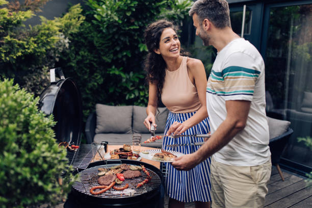 istock Happy couple making barbecue 1253434097