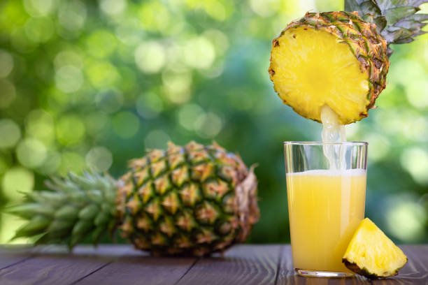 istock pineapple juice pouring into glass 1253437485