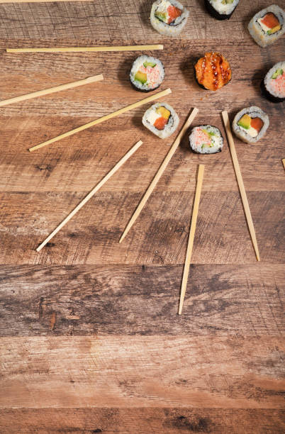 Sushi roll set with chopsticks. Japan sun concept. Place for your text or logo.