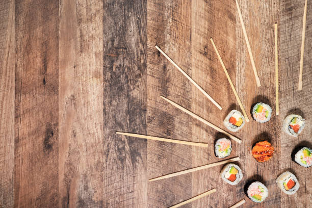Sushi roll set with chopsticks. Japan sun concept. Place for your text or logo.