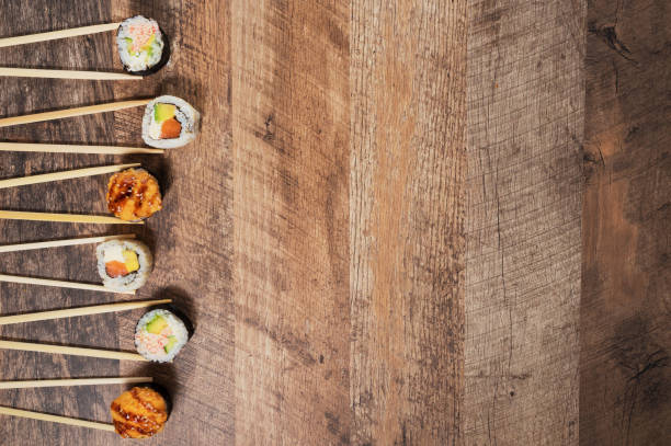 Sushi roll set with chopsticks. Place for your text or logo.