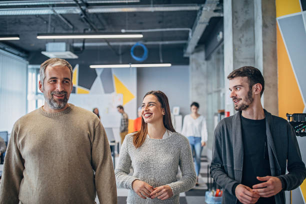istock Colleagues working together in big modern office 1253441056