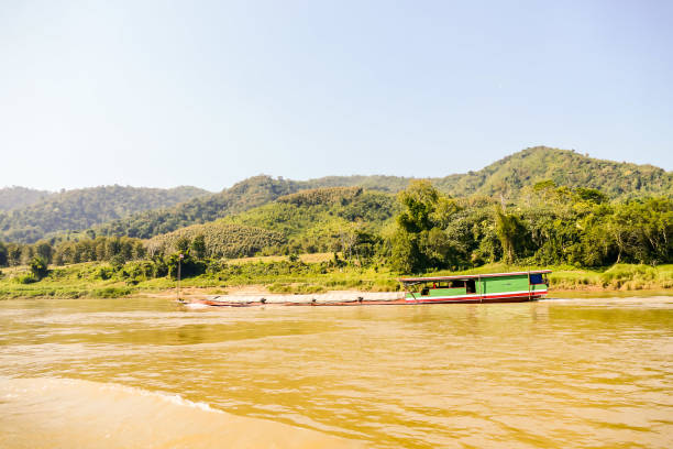 boat on the beach, digital photo picture as a background - luang phabang laos thailand mekong river imagens e fotografias de stock