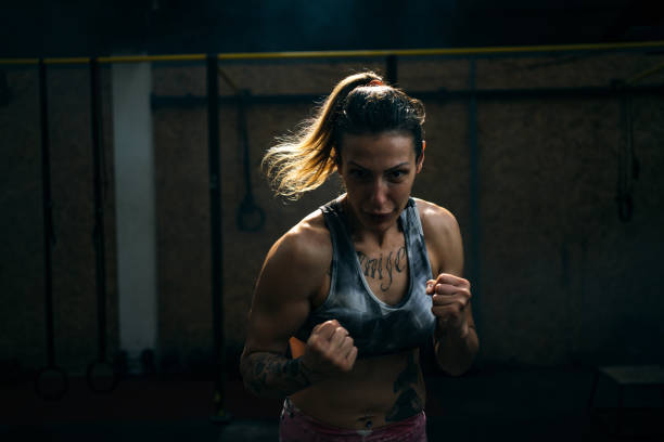 istock Young female boxer shadow boxing 1253441427