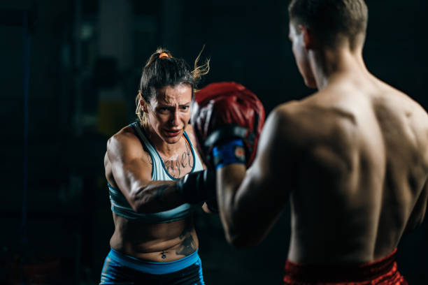 istock Woman exercises with sparring partner 1253441494