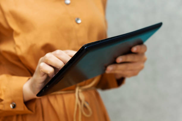 istock close up hands multitasking man using tablet, laptop and cellphone connecting wifi 1253449037