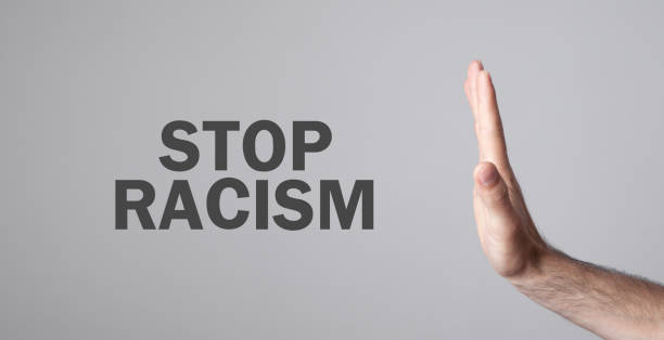 istock Male hand doing stop gesture. Stop Racism 1253449604
