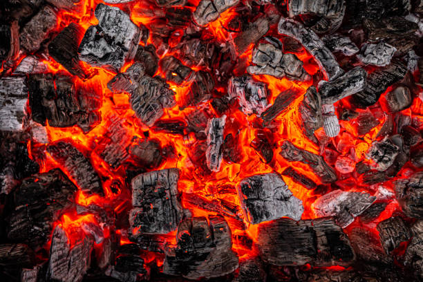 istock Hot white and black coals smolder in the grill 1253454805